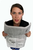 Lady reading newspaper
